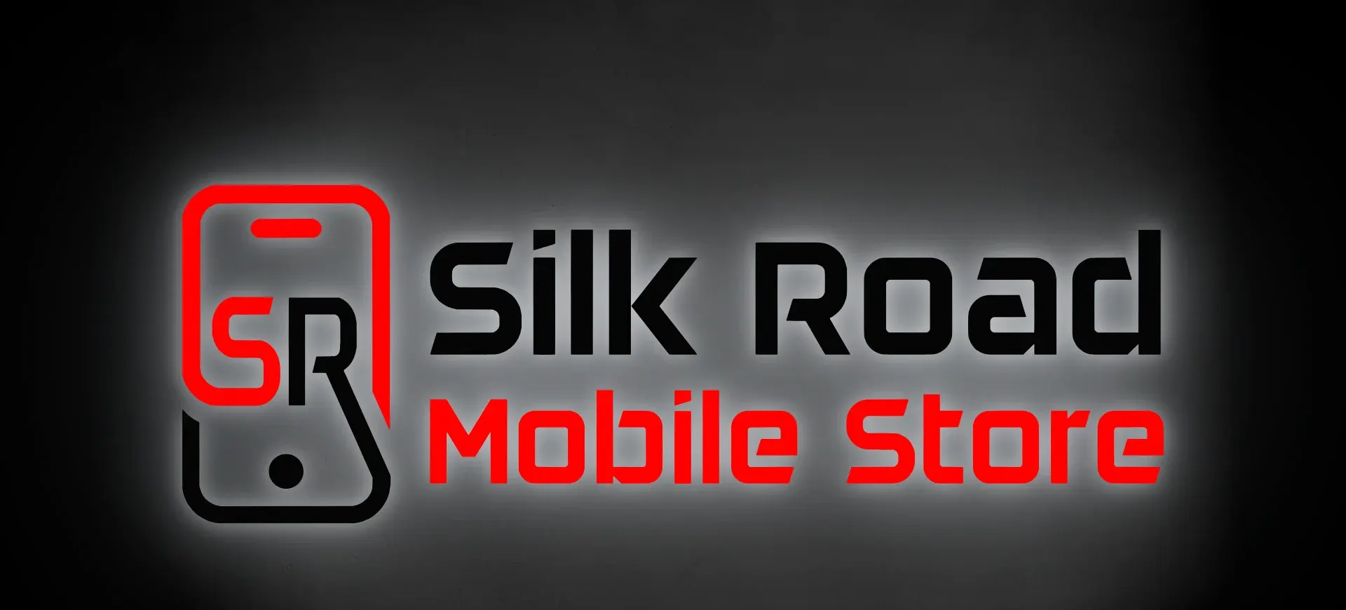 Логотип Silk Road Mobile Store из настоящего вектора с контражурной подсветкой на штукатурной стене